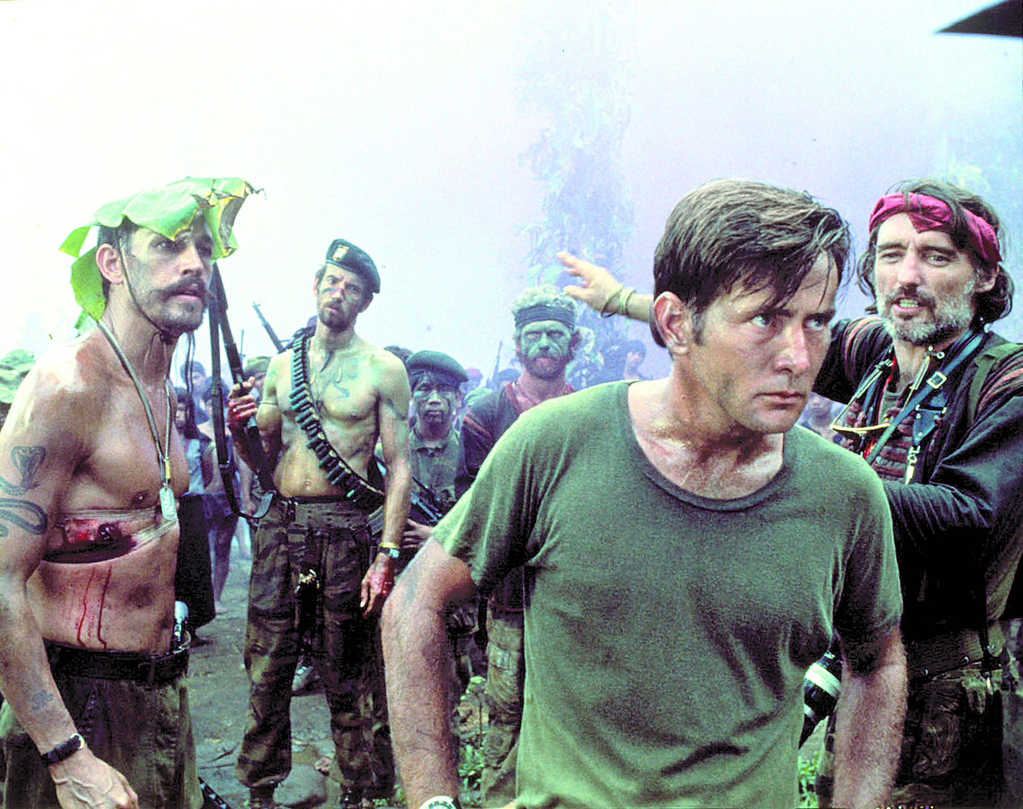Frederick Forrest, from left, Martin Sheen and Dennis Hopper survey a temple compound in