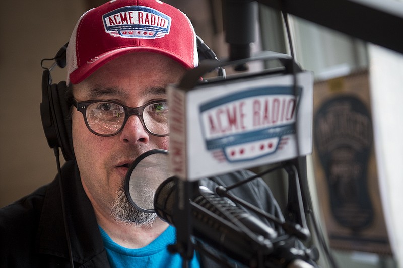 
              Tim Hibbs, DJ of The Vinyl Lunch, speaks while broadcasting his show at Acme Radio, Thursday, March 24, 2016, in Nashville, Tenn.  In the two years since it opened inside the historic building at the corner of First Avenue and Broadway, Acme has carefully cultivated a reputation as the alternative honky-tonk, with an upscale food service and music programming, unlike its well-established neighbors.   (Andrew Nelles/The Tennessean via AP) NO SALES; MANDATORY CREDIT
            