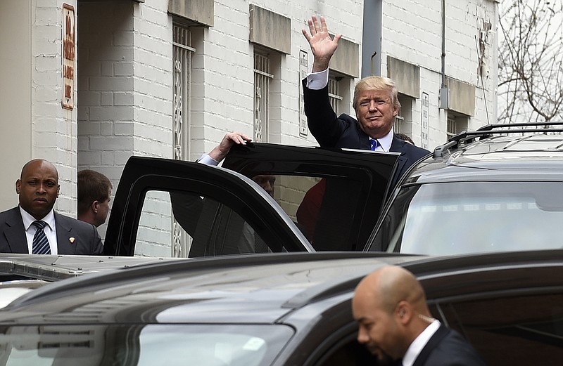 
              Republican presidential candidate Donald Trump waves as he gets into his vehicle in Washington, Thursday, March 31, 2016, following a meeting at the Republican National Committee. (AP Photo/Susan Walsh)
            