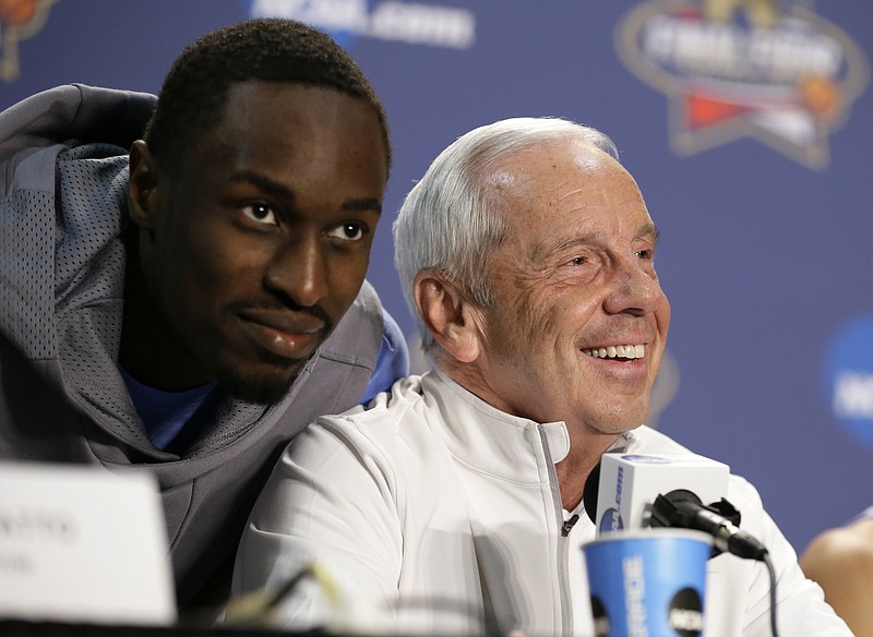 North Carolina's Theo Pinson has some fun with head coach Roy Williams during a news conference for the Final Four on Sunday in Houston.
