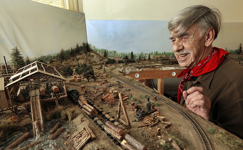 
              In this photo taken on Wednesday, March 16, 2016, Charles Edwards looks over his model train layout in Alameda, Calif. Edwards, a retired city gardener will be knocking on doors in Alameda to persuade voters to support a citizen initiative to cap rent increases. (AP Photo/Ben Margot)
            