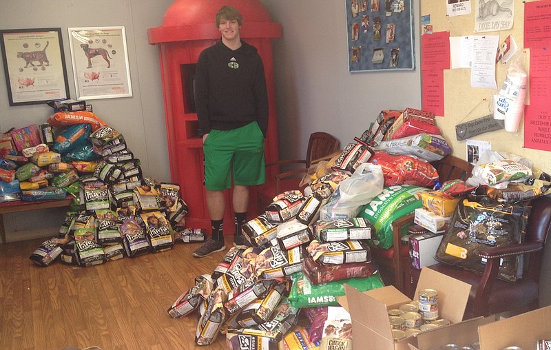 East Hamilton High School student Jacob Clark is pictured with many of the items he collected for Dixie Day Spay in Cleveland, Tenn.