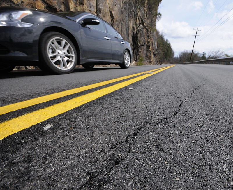 This file photo from February 2012 shows a growing crack in a section of U.S. Highway 127 on Signal Mountain. A section of the southbound lane has slid off the mountain before, and some residents are concerned it may happen again.