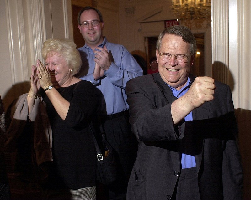 The late Tennessee state Senator Ward Crutchfield, right, gestures to supporters after winning re-election in 2000.