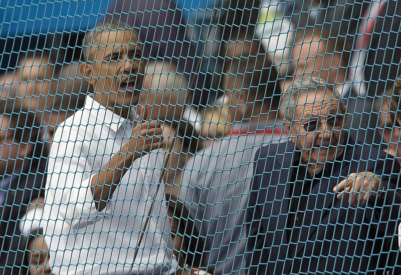 Cuban President Raul Castro, right, and U.S. President Barack Obama react to a baseball game between the Tampa Bay Rays and Cuba's national team in Havana, Cuba, last month.