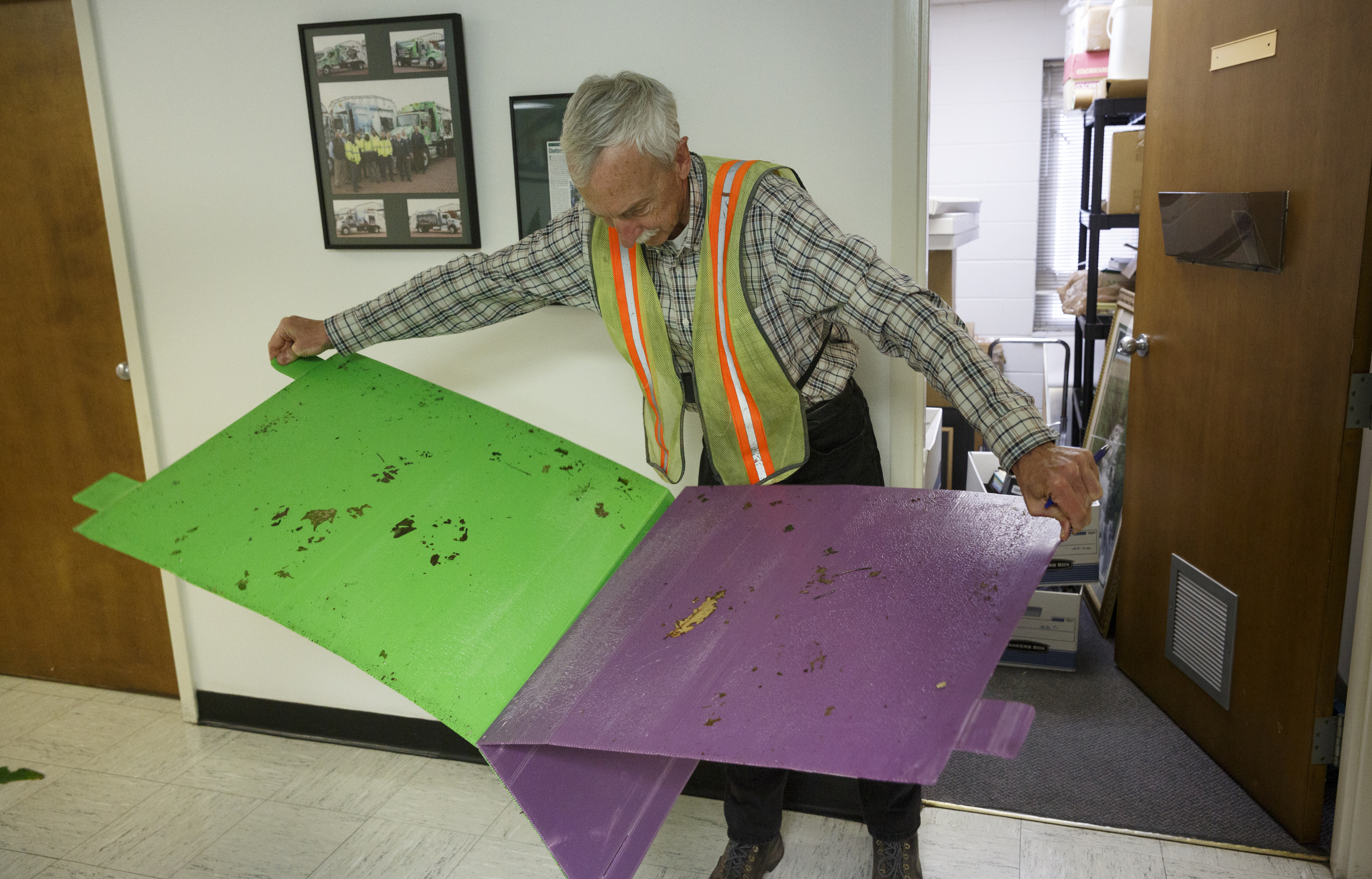 City forester Gene Hyde pulls apart two traps for the emerald ash borer beetle outside of his office Friday, April 1, 2016, in Chattanooga, Tenn. The invasive species is threatening the region's estimated 200,000 ash trees.