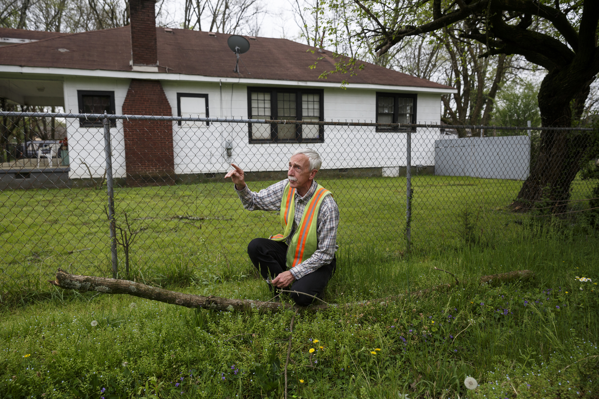 City forester Gene Hyde points out a branch of ash infested by the emerald ash beetle which fell from a dead tree in the yard of Jimmy Voyles on Friday, April 1, 2016, in Chattanooga, Tenn. The invasive species is threatening the region's estimated 200,000 ash trees.