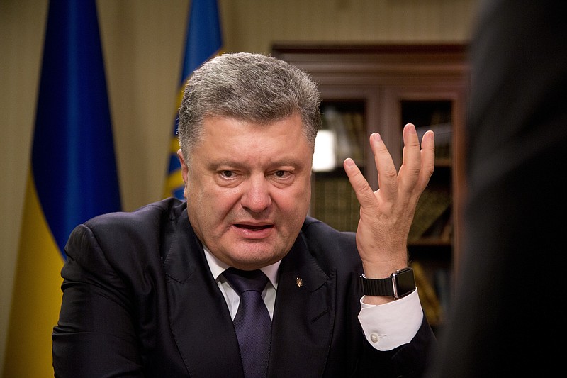 
              FILE - In this Monday, July 13, 2015 file photo, Ukrainian President Petro Poroshenko speaks during an interview in Kiev, Ukraine. Ukraine’s President Petro Poroshenko has found himself amid a perfect political storm over the leaked documents from a Panamanian firm pointing at his offshore assets, with some of his political adversaries calling for his removal from office. Poroshenko insisted Monday, April 4, 2016 that he has done nothing wrong and hasn’t managed his assets since being elected. (AP Photo/Efrem Lukatsky, file)
            