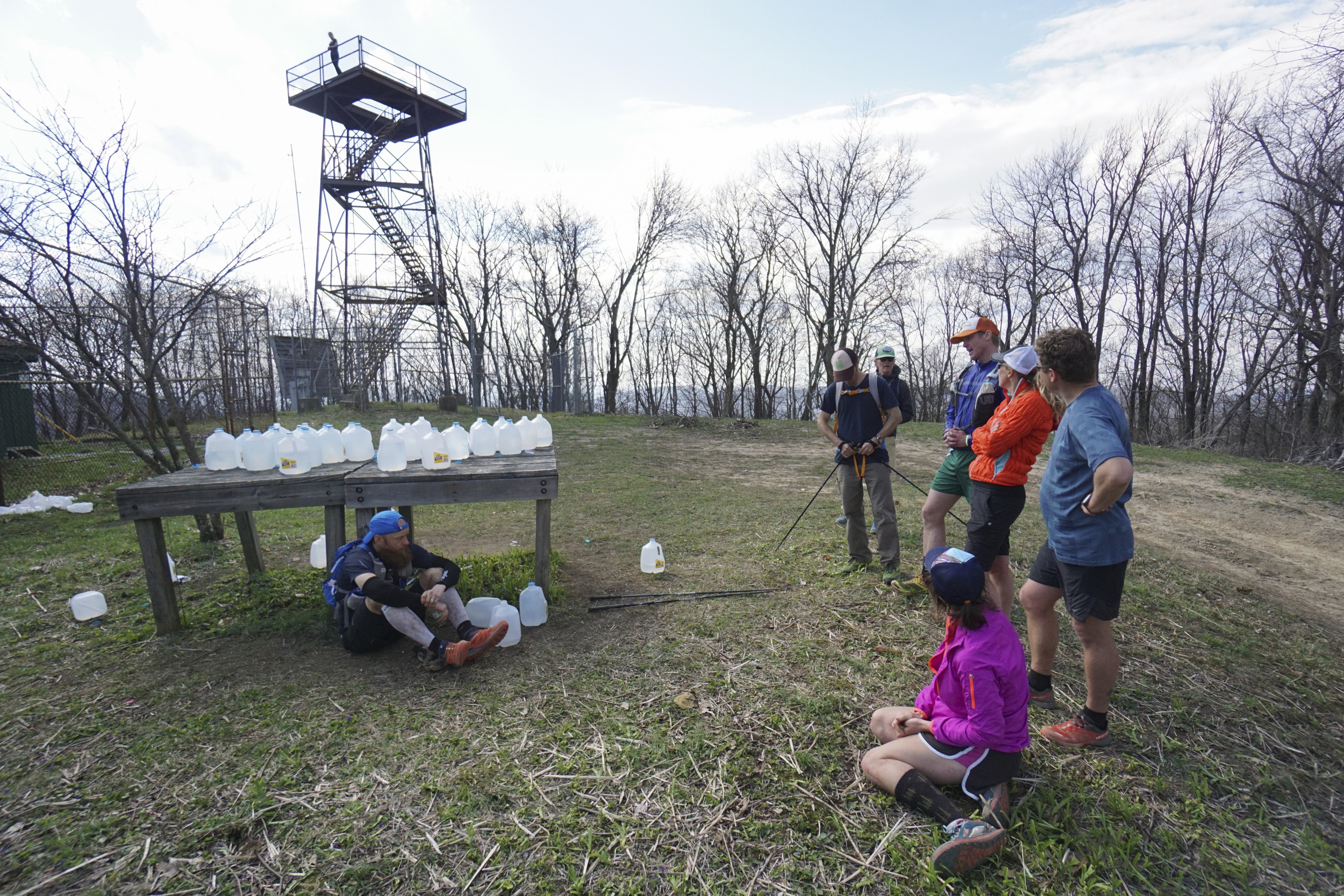 Staff Photo by Dan Henry / The Chattanooga Times Free Press- 4/4/16. Gary Robbins rests in the shade for a moment during his fifth loop and speaks to other racers who dropped out while at the Frozen Head Lookout Tower during the 30th running of the Barkley Marathons at Frozen Head State Park in Warburg, Tenn., on April 4, 2016. Robbins completed four and a half loops before pulling himself from the race due hallucinations from lack of sleep. The Barkley Marathons is part orienteering, part ultra marathon where a select few attempt to complete up to five 20 mile loops within a 60-hour time limit where they search for hidden book caches deep in the woods throughout the park.
