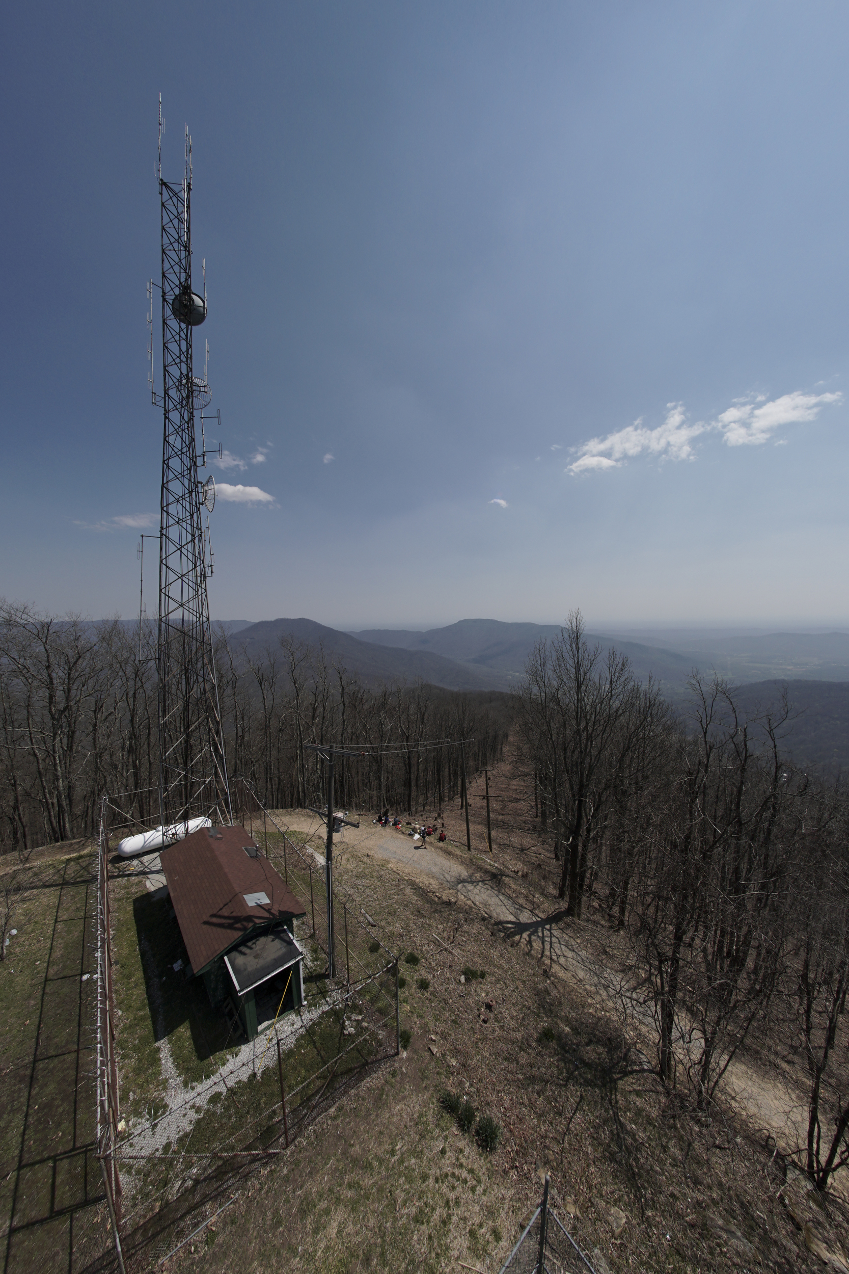 Staff Photo by Dan Henry / The Chattanooga Times Free Press- 4/4/16. Spectators watch as Gary Robbins makes his way up "Rat Jaw" to the Frozen Head Lookout Tower on his fifth loop where a water drop and braille book await during the 30th running of the Barkley Marathons at Frozen Head State Park in Warburg, Tenn., on April 4, 2016. Robbins completed four and a half loops before pulling himself from the race due hallucinations from lack of sleep. The Barkley Marathons is part orienteering, part ultra marathon where a select few attempt to complete up to five 20 mile loops within a 60-hour time limit where they search for hidden book caches deep in the woods throughout the park.