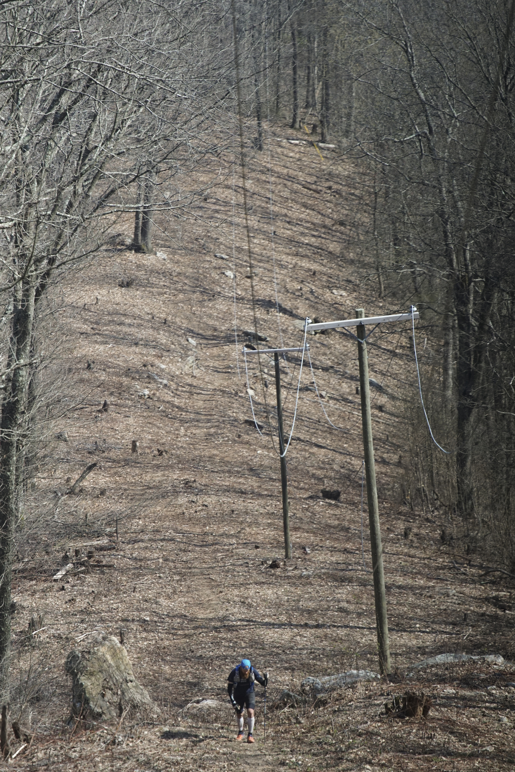 Staff Photo by Dan Henry / The Chattanooga Times Free Press- 4/4/16. Gary Robbins makes his way up "Rat Jaw" to the Frozen Head Lookout Tower on his fifth loop where a water drop and braille book await during the 30th running of the Barkley Marathons at Frozen Head State Park in Warburg, Tenn., on April 4, 2016. Robbins completed four and a half loops before pulling himself from the race due hallucinations from lack of sleep. The Barkley Marathons is part orienteering, part ultra marathon where a select few attempt to complete up to five 20 mile loops within a 60-hour time limit where they search for hidden book caches deep in the woods throughout the park.