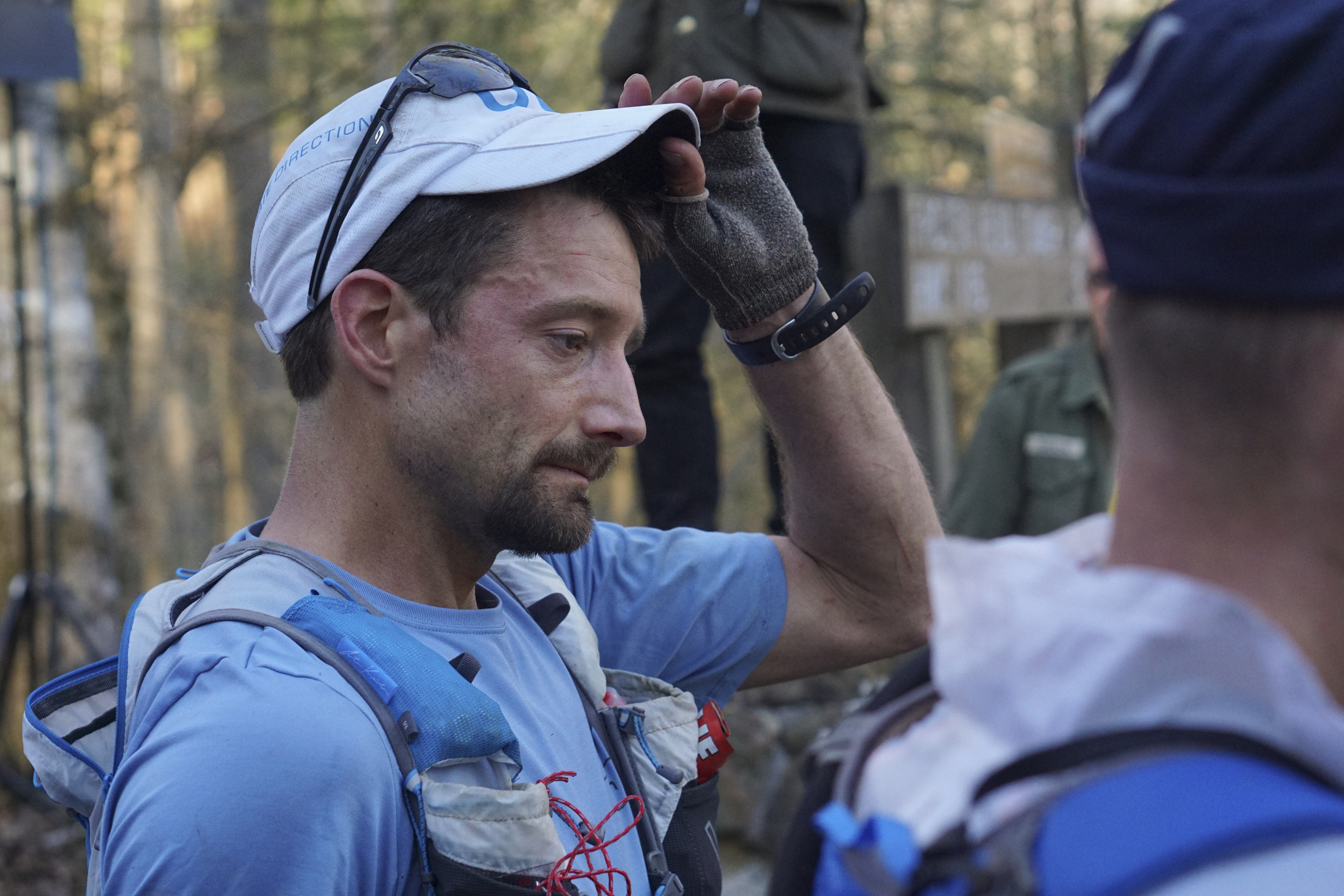 Staff Photo by Dan Henry / The Chattanooga Times Free Press- 4/4/16. Jared Campbell returns to the campsite from his third loop during the 30th running of the Barkley Marathons at Frozen Head State Park in Warburg, Tenn., on April 3, 2016. Campbell completed the race earning the designation of the first person to ever finish three times. The Barkley Marathons is part orienteering, part ultra marathon where a select few attempt to complete up to five 20 mile loops within a 60-hour time limit where they search for hidden book caches deep in the woods throughout the park.