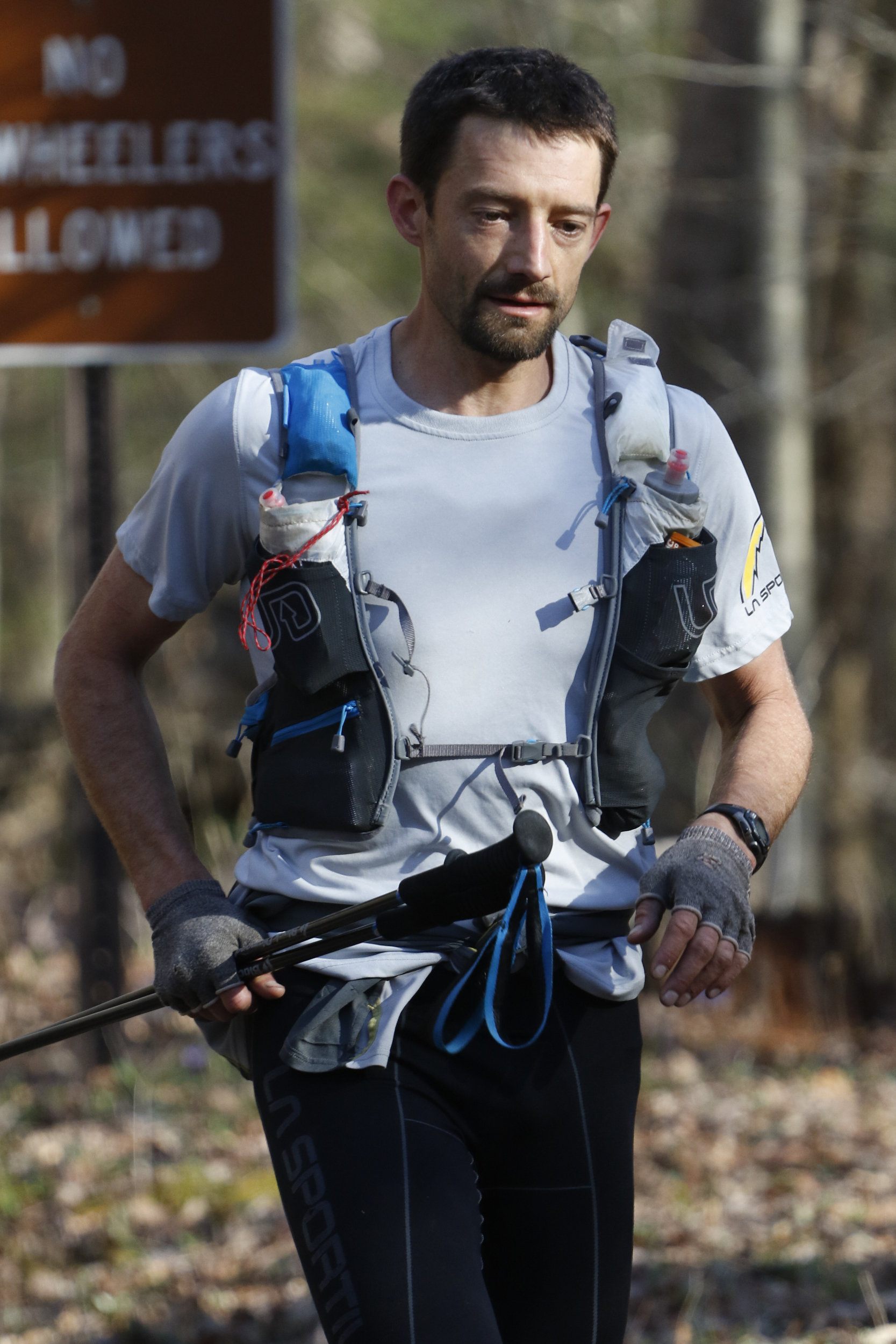 Staff Photo by Dan Henry / The Chattanooga Times Free Press- 4/4/16. Jared Campbell returns to the campsite from his third loop during the 30th running of the Barkley Marathons at Frozen Head State Park in Warburg, Tenn., on April 3, 2016. Campbell completed the race earning the designation of the first person to ever finish three times. The Barkley Marathons is part orienteering, part ultra marathon where a select few attempt to complete up to five 20 mile loops within a 60-hour time limit where they search for hidden book caches deep in the woods throughout the park.