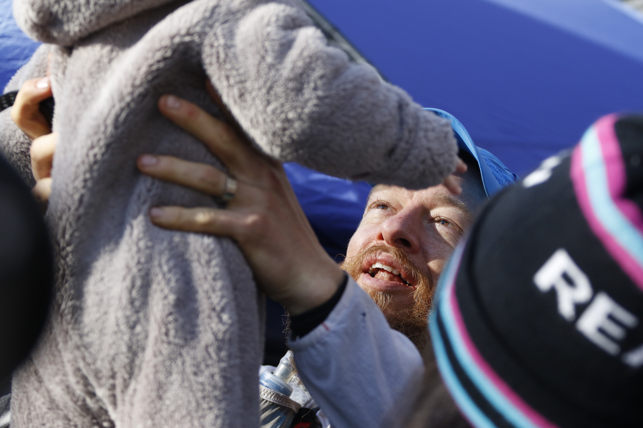 Staff Photo by Dan Henry / The Chattanooga Times Free Press- 4/4/16. Gary Robbins tosses his son Reed in the air before heading out on his fifth loop during the 30th running of the Barkley Marathons at Frozen Head State Park in Warburg, Tenn., on April 4, 2016. Robbins completed four and a half loops before pulling himself from the race due hallucinations from lack of sleep. The Barkley Marathons is part orienteering, part ultra marathon where a select few attempt to complete up to five 20 mile loops within a 60-hour time limit where they search for hidden book caches deep in the woods throughout the park.