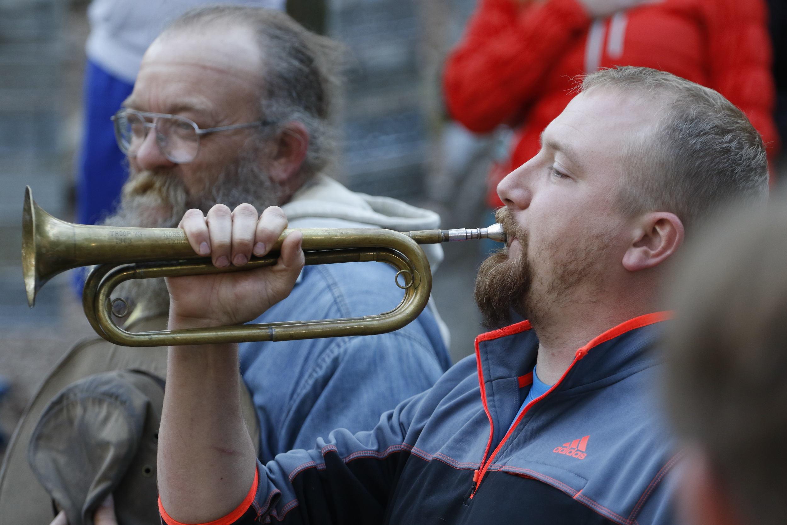 Staff Photo by Dan Henry / The Chattanooga Times Free Press- 4/3/16. "Danger" Dave Henn plays taps on the bugle as Iso Yucra pulls himself from the race during the 30th running of the Barkley Marathons at Frozen Head State Park in Warburg, Tenn., on April 2-4, 2016. The Barkley Marathons is part orienteering, part ultra marathon where a select few attempt to complete up to five 20 mile loops within a 60-hour time limit where they search for hidden book caches deep in the woods throughout the park.