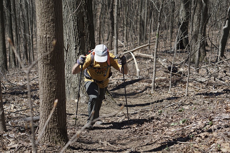 Staff Photo by Dan Henry / The Chattanooga Times Free Press- 4/3/16. Dale Holdaway, originally from Michigan currently living in Brazil, makes his way up the Chimney Top Trail on his third loop during the 30th running of the Barkley Marathons at Frozen Head State Park in Warburg, Tenn., on April 3, 2016. This was Holdaway's fifth attempt and he missed the 40-hour "Fun Run" (3-lap) cutoff by a few hours upon completing his third lap. The Barkley Marathons is in its 30th year and consists of part orienteering and part ultra marathon where a select few attempt to complete five 20 mile loops within a 60-hour time limit where they search for hidden book caches deep in the woods throughout the park. 