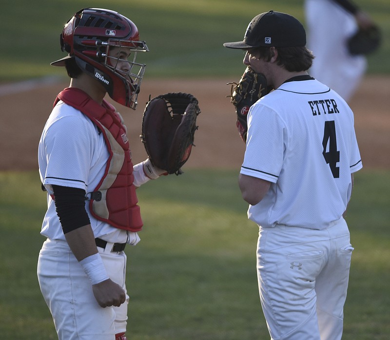 Signal Mountain High School pitcher Jackson Etter talks with catcher Garrett Hensley as their team hosts Bledsoe County on Tuesday, Apr. 5, 2016, in Signal Mountain, Tenn. 