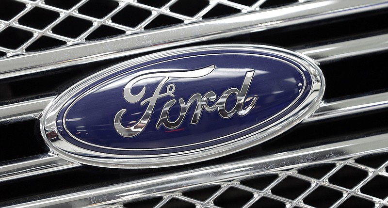 
              FILE - In this Jan. 5, 2015, file photo, the Ford logo shines on the front grille of a 2014 Ford F-150, on display at a local dealership in Hialeah, Fla. Ford will build a new $1.6 billion factory in Mexico, creating about 2,800 jobs and shifting small-car production from the U.S. The announcement Tuesday, April 5, 2016 comes at a time when moving jobs to the south has become a major issue in the U.S. presidential campaign. (AP Photo/Alan Diaz, File)
            