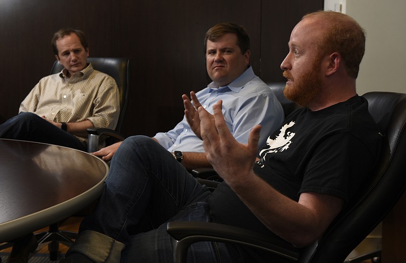 Photographed at the offices of the Lamp Post Group on Monday, Apr. 4, 2016, in Chattanooga, Tenn., Barry Large, Ted Alling and Allan Davis, from left, are the founders of Access America Transport, a company they sold in 2014. They have recently launched Dynamo, a company that is a logistics accelerator. 