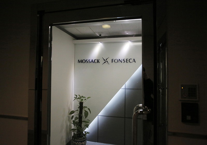 
              FILE - This April 5, 2016 file photo shows the entrance of the regional head office of Panama-based law firm Mossack Fonseca, one of the world's biggest creators of shell companies, in Hong Kong,  America's openness to foreign tax evaders is coming under new scrutiny after the leak this week of 11.5 million confidential documents from the Panamanian law firm. The Panama Papers show how some of the world's richest people hide assets in shell companies to avoid paying taxes. (AP Photo/Vincent Yu)
            