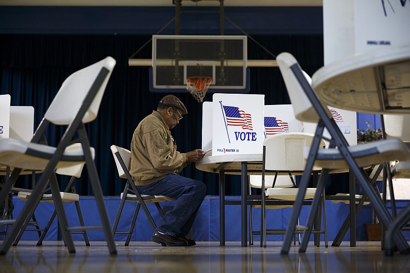 Edward Carter votes in the Super Tuesday primary election at the Bethlehem Center polling site in Chattanooga on March 1, 2016.