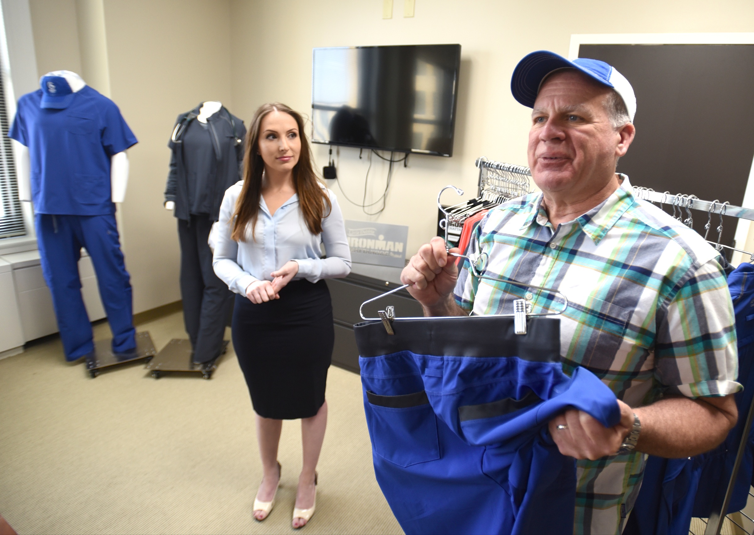 George Brown, right, and Audrey Mosley talk Wednesday, March 30, 2016 about anti-microbial scrubs.