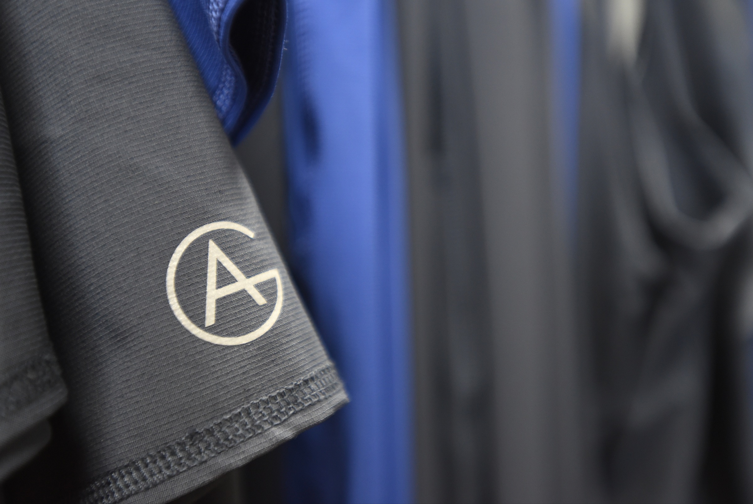 Anti bacterial clothing items bear the Aegle Gear logo.