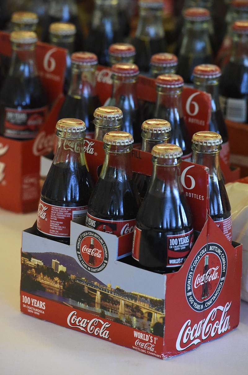 A variety of commemorative Coke bottles are displayed as the Choo Choo Chapter of the Coca-Cola Collectors Club meets at the Chattanooga Choo Choo on Nov. 14, 2015.