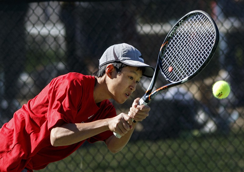 Baylor tennis player Brandon Kali returns the ball in his boys A-4 singles final match against St. Xavier's Spencer Blandford at the Rotary tennis tournament at Baylor School on Saturday, April 9, 2016, in Chattanooga, Tenn.
