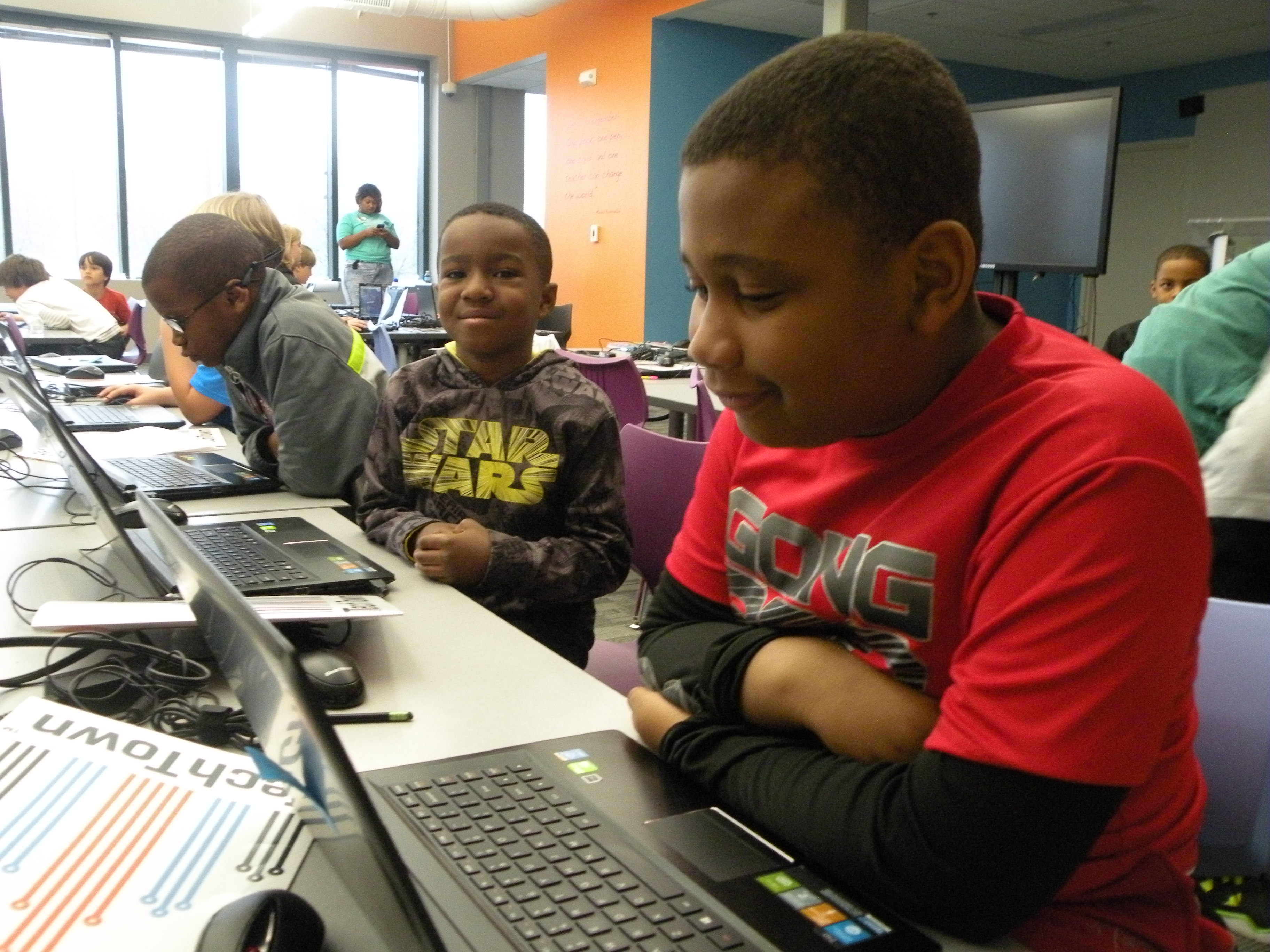 Jamari Kennedy, left, and Daniel Smith work on their laptops.