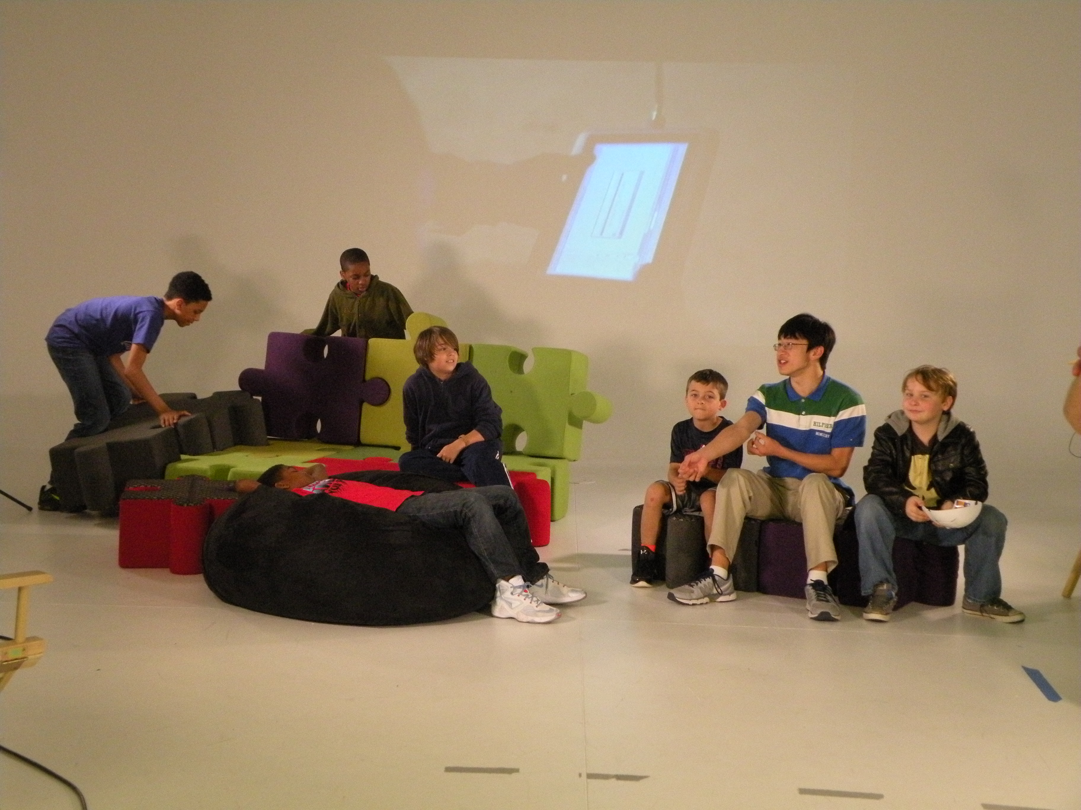 Campers in the videography track work on a project.
