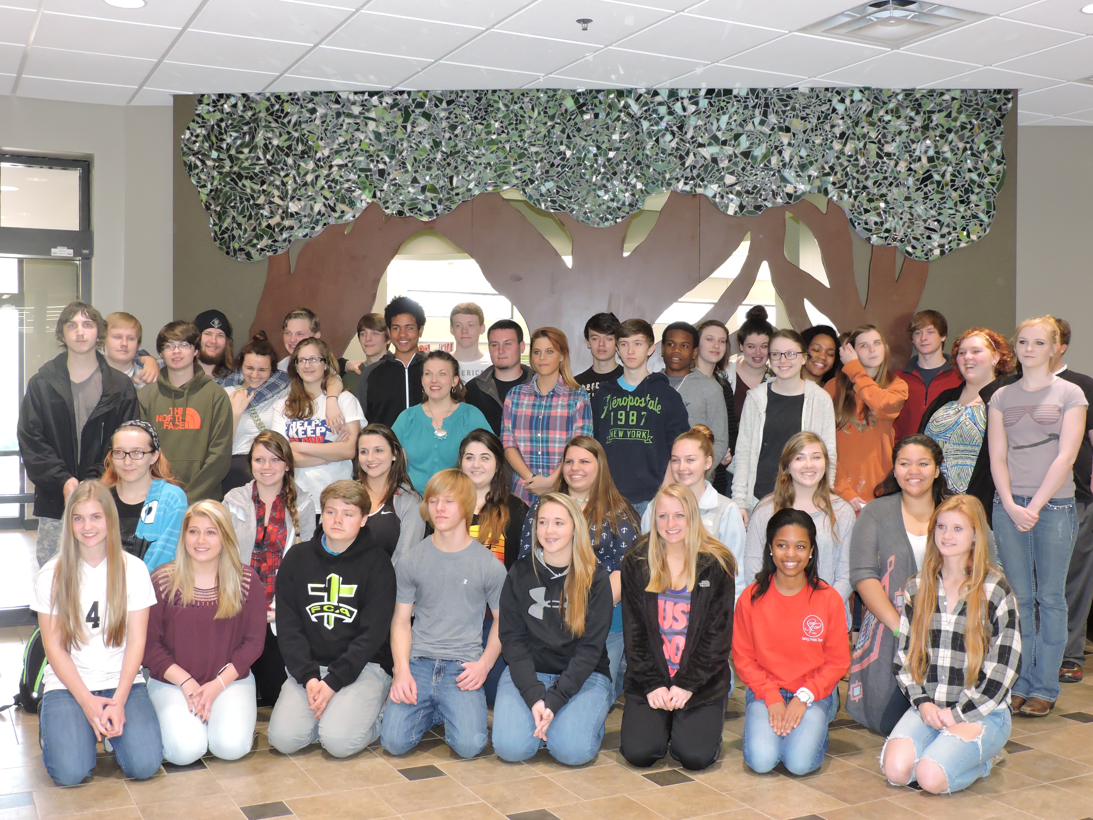 LaFayette-Walker County Library welcomes the LaFayette High School art students who created the mosaic tree in the background for the library's Children's Department.