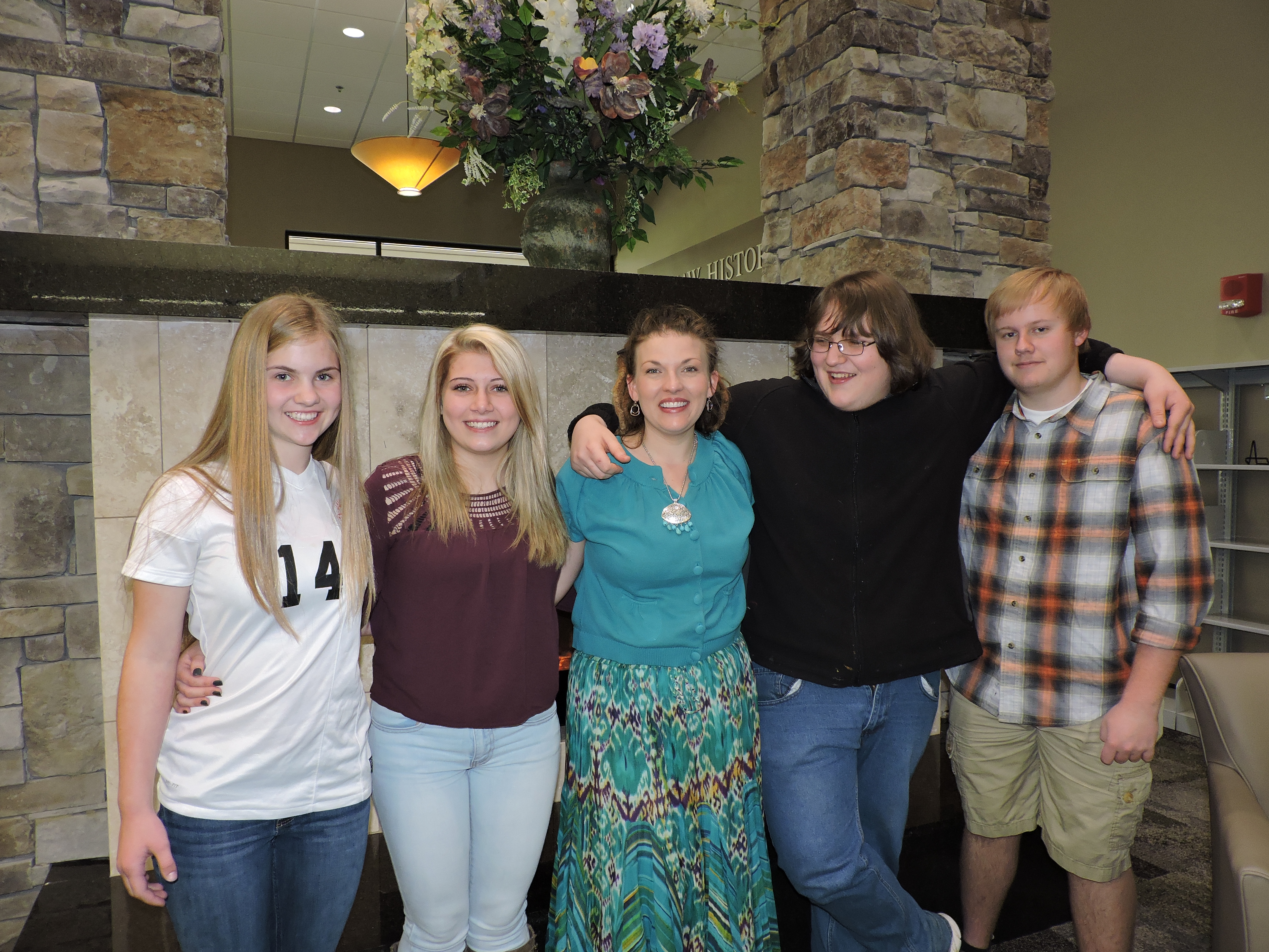 The LaFayette-Walker County Library welcomes LaFayette High School art students for the unveiling of the mosaic tree they created for the Children's Department. From left are Summer Knight, Elizabeth Miller, LHS art teacher Heather Hawkins-Parker, Andrew Halliday and Branton Kimbell.