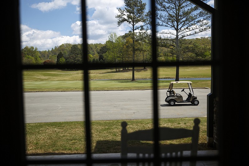 A golf cart is parked outside of the clubhouse at the LaFayette Municipal Golf Course on Friday, April 8, 2016, in Chattanooga, Tenn. The course has been losing about $150,000 a year since 1998.