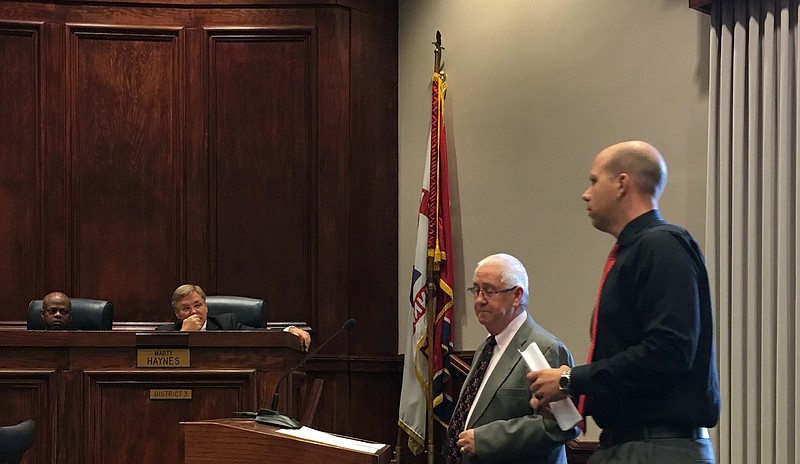 Hamilton County Criminal Court Clerk Vince Dean and the department's lead accountant, Hunter Kirkpatrick, right, discuss a request to the County Commission for $300,000 to mitigate personnel budget shortfalls within the office.