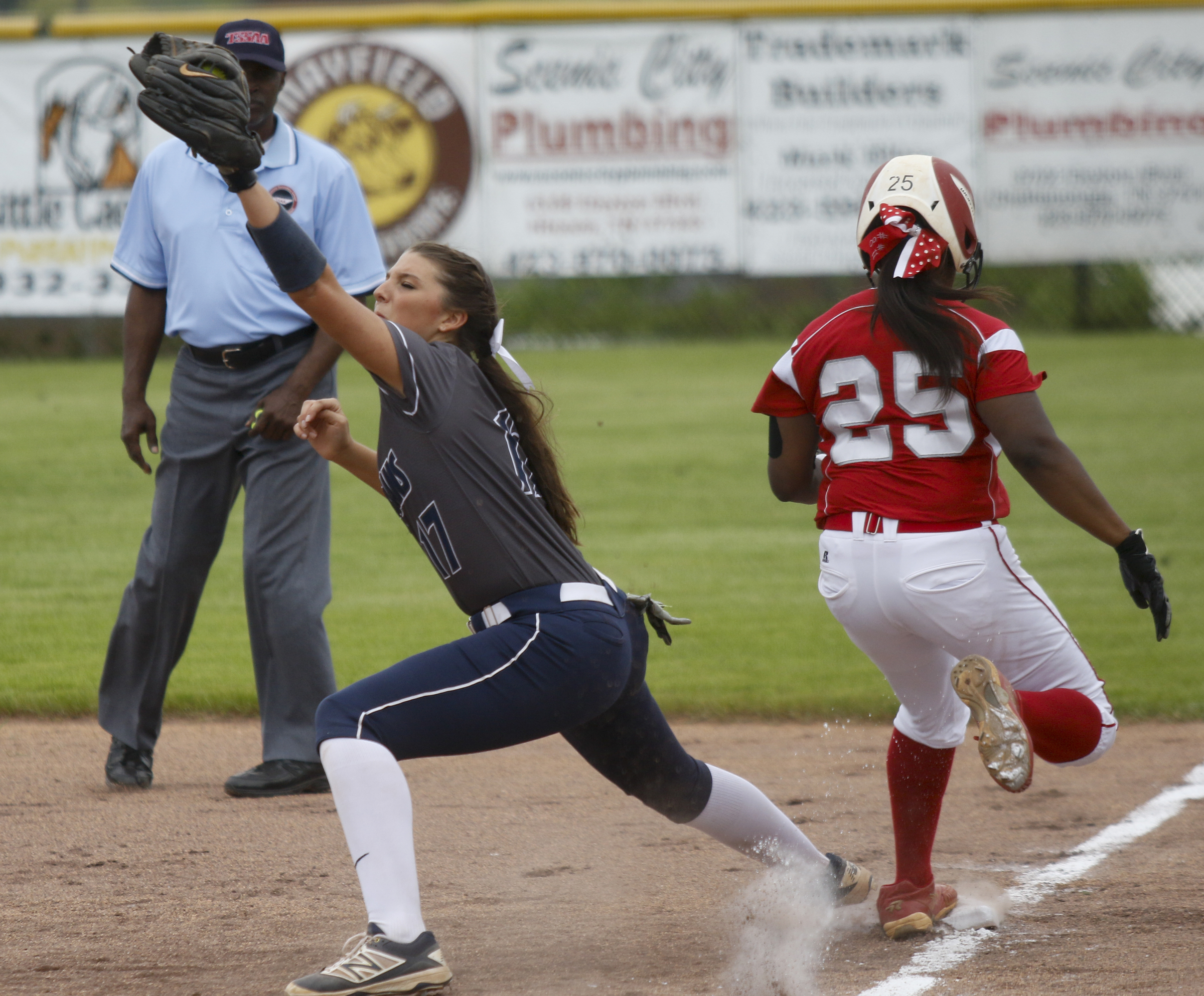 Ooltewah runner Kayla Boseman is forced out at 1st by a throw to Soddy-Daisy 1st baseman Macy Bryant during their softball game at Soddy-Daisy High School on Wednesday, April 13, 2016, in Soddy-Daisy, Tenn.