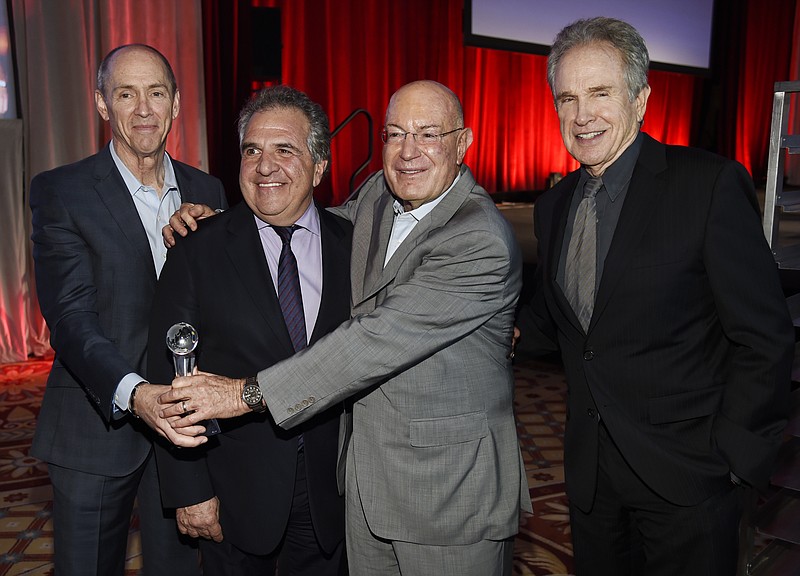 
              Producer Arnon Milchan, second from right, recipient of the "Legend of Cinema" award, poses with, left to right, 20th Century Fox domestic distribution chief Chris Aronson, Fox Filmed Entertainment chairman and CEO Jim Gianopulos and actor/director Warren Beatty during CinemaCon 2016, the official convention of the National Association of Theatre Owners (NATO), at Caesars Palace on Wednesday, April 13, 2016, in Las Vegas. (Photo by Chris Pizzello/Invision/AP)
            