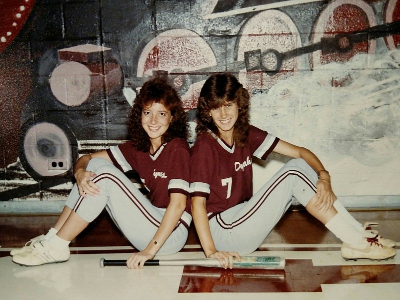 Arts & Sciences softball coach Michelle Meyners, right, is shown during her Chattanooga High School playing days with teammate and friend Bonny Frank, who died of a brain aneurysm. More than two decades after her friend's death, Meyners suffered a burst aneursym and survived.