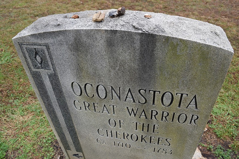 A marker for the Cherokee warrior Oconastota stands in December 2015 at the Chota Memorial site about 12 miles south of the Sequoyah Birthplace Museum in Vonore, Tenn. Oconastota died in 1783. Small rocks, shells and tree nuts left atop the stone mark visitors' passaage.