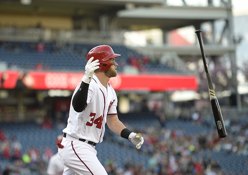 
              Washington Nationals' Bryce Harper watches his grand slam during the third inning of an baseball game against the Atlanta Braves, Thursday, April 14, 2016, in Washington. This was Harpers' 100th home run of his career. (AP Photo/Nick Wass)
            