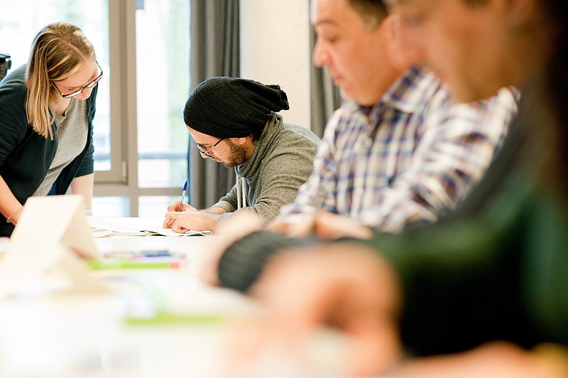 
              Claudia Hubatsch, left, teaches German to a class of people who were teachers in Syria   and are now part of a program to enable them to teach in Germany  at the University of Potsdam , Germany, Thursday April 14, 2016. The University of Potsdam, just outside Berlin, this week started intensive German courses for 25 Syrians -  the first part of an 11-month course that aims to familiarize them with the language and the country’s education system.   ( Klaus-Dietmar Gabbert/dpa via AP)
            