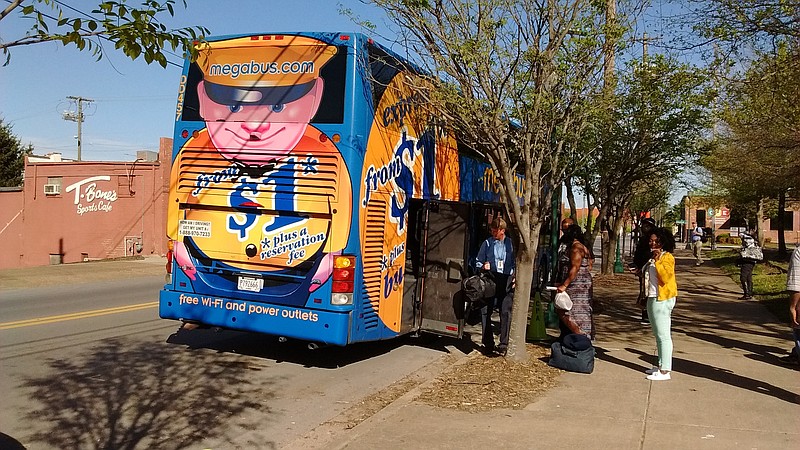 The Megabus from Atlanta stops Friday afternoon on South Main Street across from T-Bone's Sports Cafe.