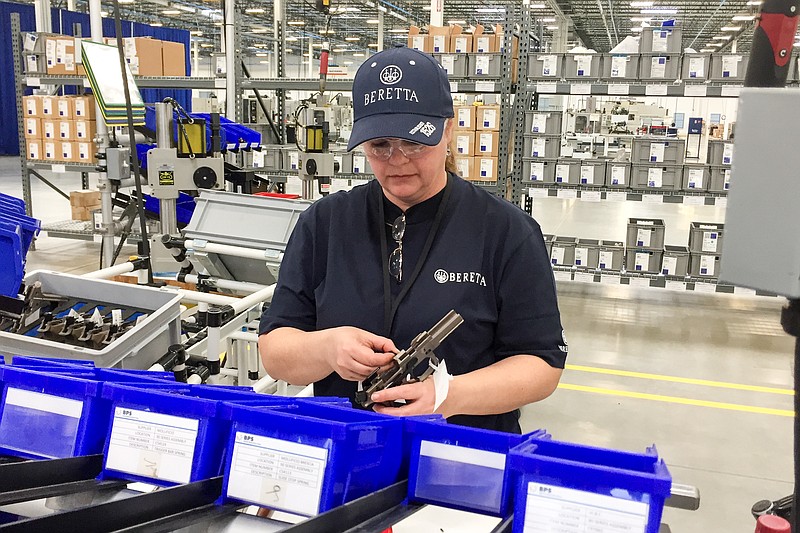 A worker assembles a handgun at the new Beretta plant in Gallatin, Tenn., on Friday, April 15, 2016. The Italian gun maker has cited Tennessee's support for gun rights in moving its production from its plant in Maryland.