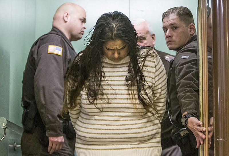 
              FILE - In this Monday, March 30, 2015 file photo, Purvi Patel is taken into custody after being sentenced to 20 years in prison for feticide and neglect of a dependent, at the St. Joseph County Courthouse in South Bend, Ind. Lynn Paltrow, executive director of National Advocates for Pregnant Women, said it marked the first time a woman in the U.S. has been convicted and sentenced for attempting to end her pregnancy. (Robert Franklin/South Bend Tribune via AP)
            