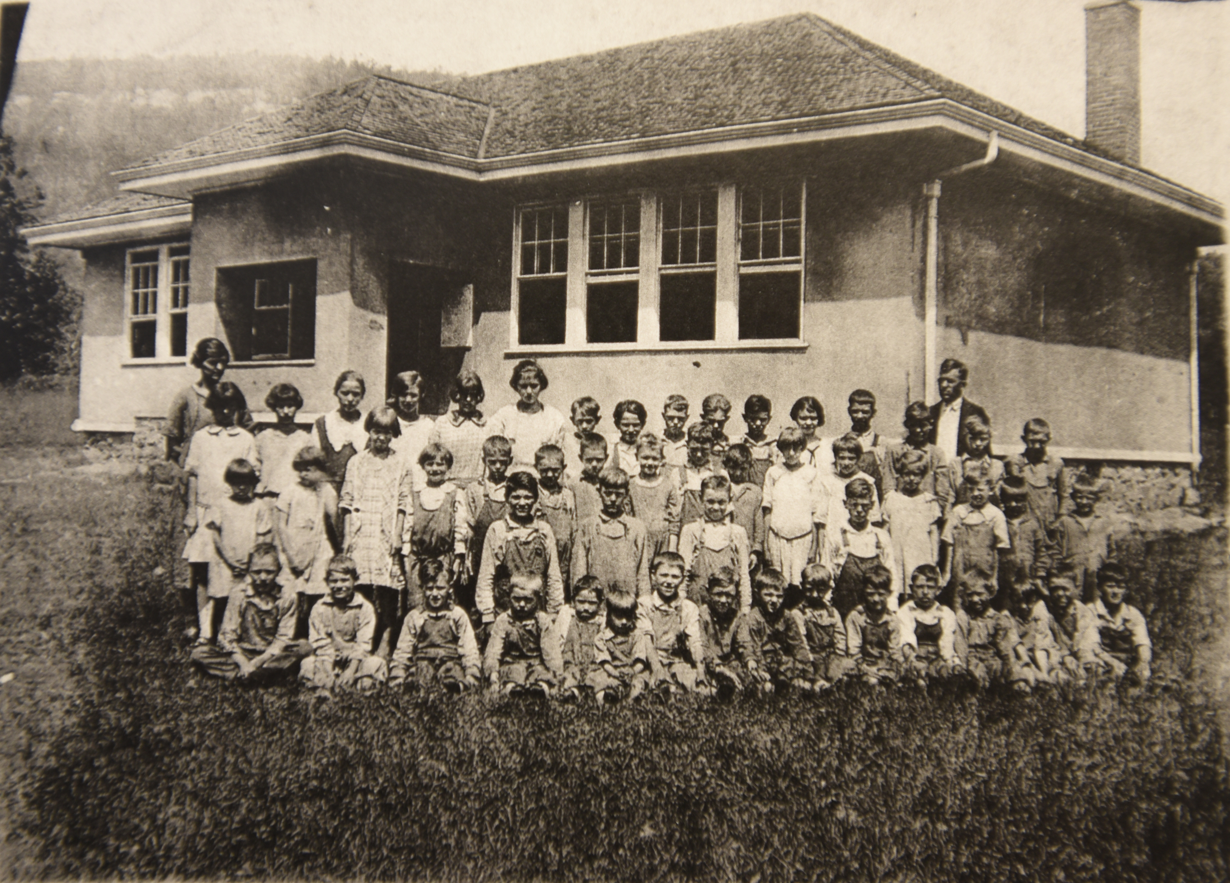 A photo of the first Falling Water School building, built in 1912 and torn down in 1937, hangs on the wall Wednesday, April 13, 2016 at Falling Water Elementary School.