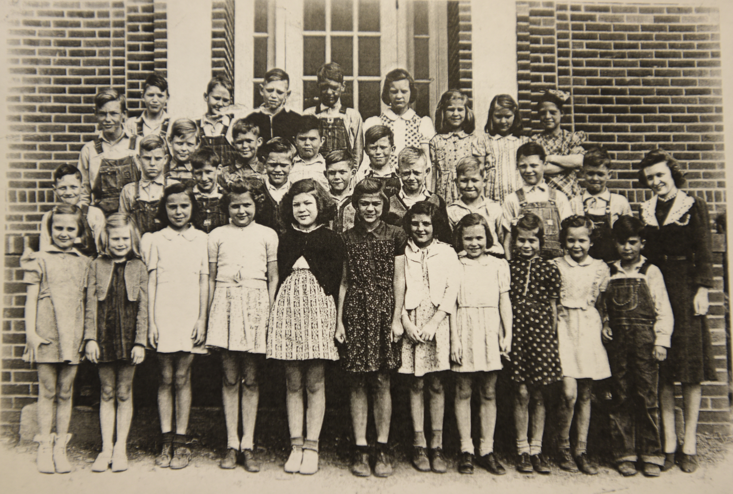 A photo of the 1939-1940 3rd and 4th grade classes hangs on the wall Wednesday, April 13, 2016 at Falling Water Elementary School.