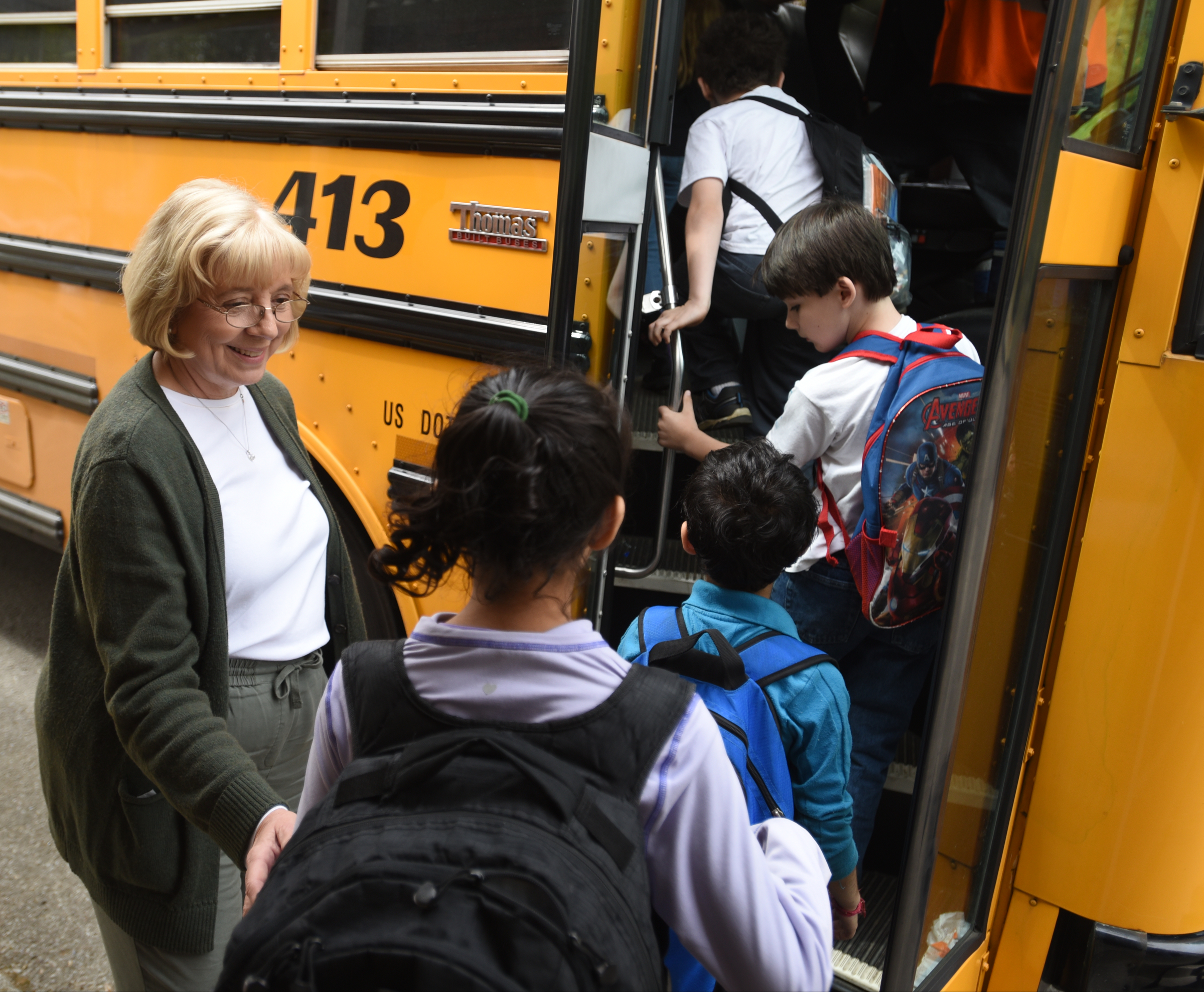 Principal Lea Ann Burk talks with kids as they get on the bus Wednesday, April 13, 2016 at Falling Water Elementary School.