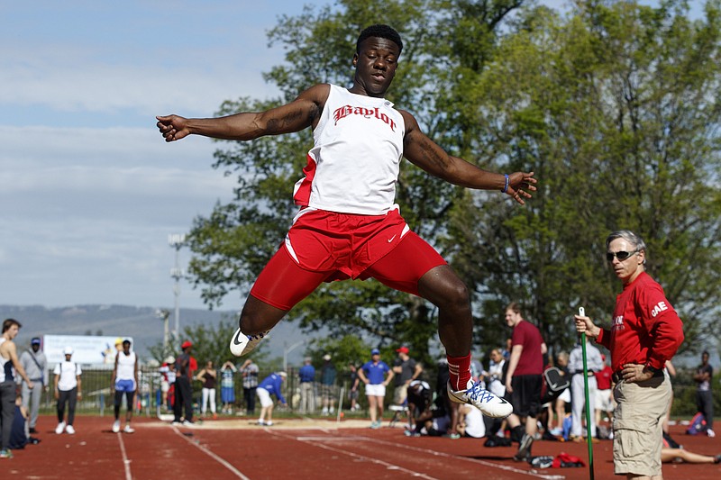 Baylor athlete Ulysses Strawter competes in the long jump at McCallie Mid-South track invitational at McCallie School on Saturday, April 16, 2016, in Chattanooga, Tenn.