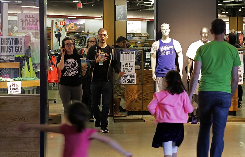
              Shoppers walk through a Sport Chalet store in downtown Los Angeles Saturday, April 16, 2016. The Southern California-based chain says it has begun closing all its stores and has stopped selling merchandise online. Founded in 1959, the sporting goods company has about 50 locations in California, Arizona, Nevada and Utah. The company offered no explanation for the closure. (AP Photo/Reed Saxon)
            