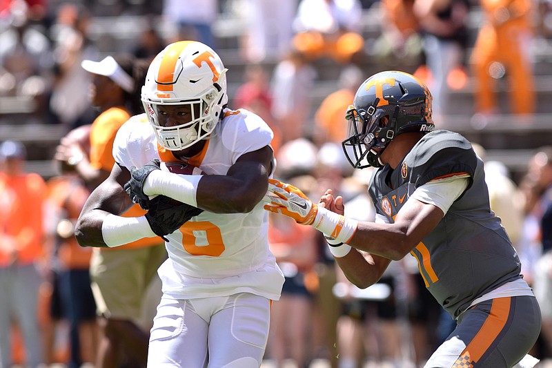 Alvin Kamara (6) takes a handoff from Joshua Dobbs (11) during practice.  The University of Tennessee Orange/White Spring Football Game was held at Neyland Stadium in Knoxville on April 16, 2016.